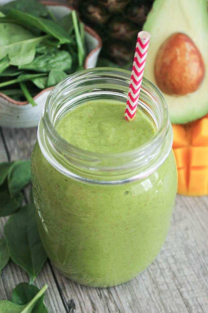 vegan-tropical-green-smoothie-with-avocado-spinach-mango-pineapple-and-chia-seeds